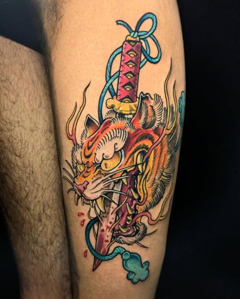 Neo-traditional tiger sword tattoo by @angelo.oxblood