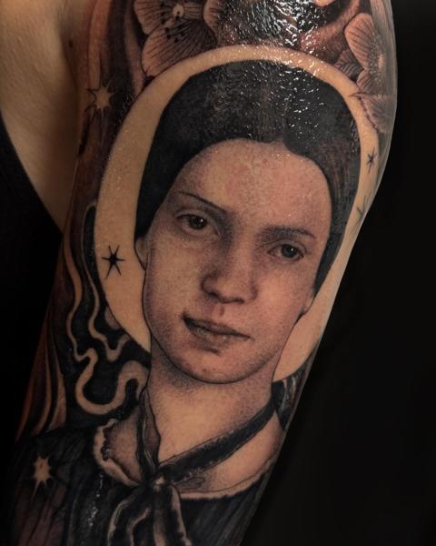 Realism portrait with flowers tattoo by @aimeecornwelltattoo