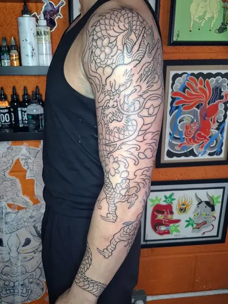 Japanese dragon outline tattoo by @akhil.tattoo