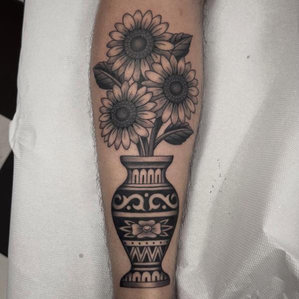 Traditional sunflowers in vase tattoo by @al_pomeroy