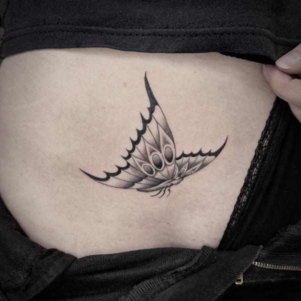 Blackwork butterfly tattoo by @al_pomeroy