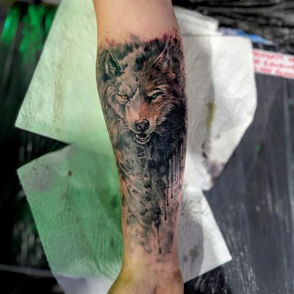 Realism wolf portrait tattoo by @aleksgtattooart