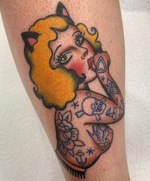 Traditional pin-up cat woman tattoo by @bratbabytattoo