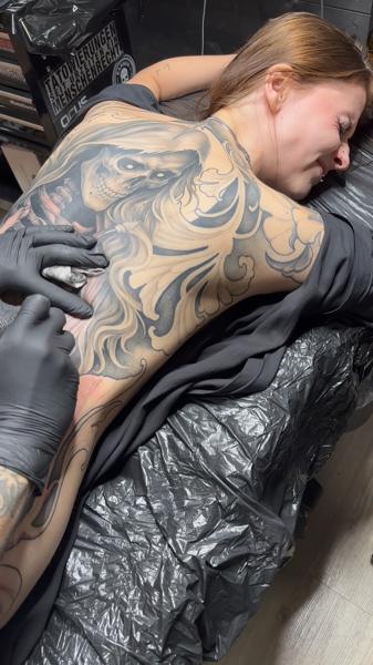 Realism skull and smoke tattoo by @alex_scharow