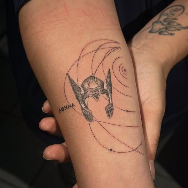 Fine line athena helmet tattoo by @dahoonietattoo