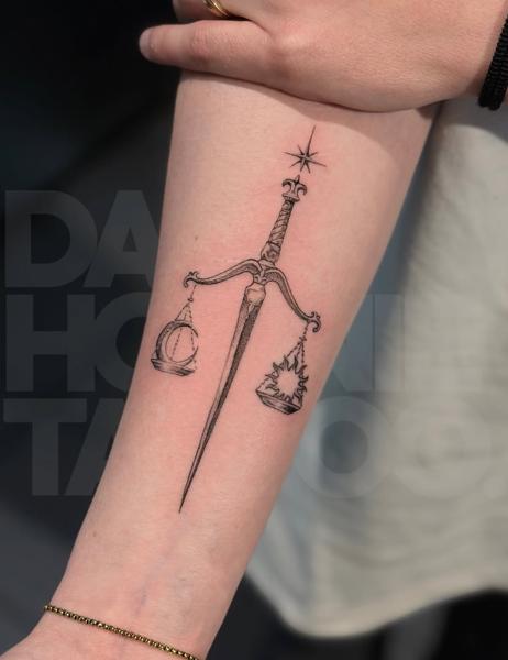 Fine line celestial sword scale tattoo by @dahoonietattoo