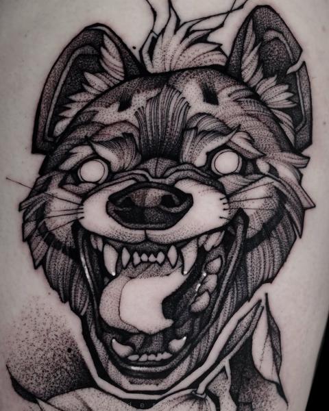 Blackwork snarling wolf tattoo by @alexunderwood_tattoo