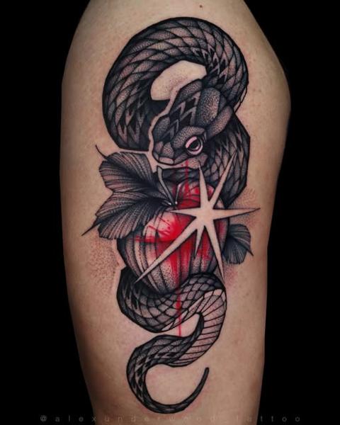 Blackwork snake and star tattoo by @alexunderwood_tattoo