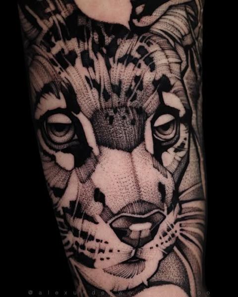 Dotwork leopard face tattoo by @alexunderwood_tattoo