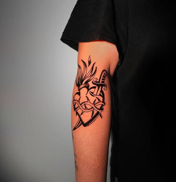 Traditional sacred heart dagger tattoo by @christinis_inkaholic