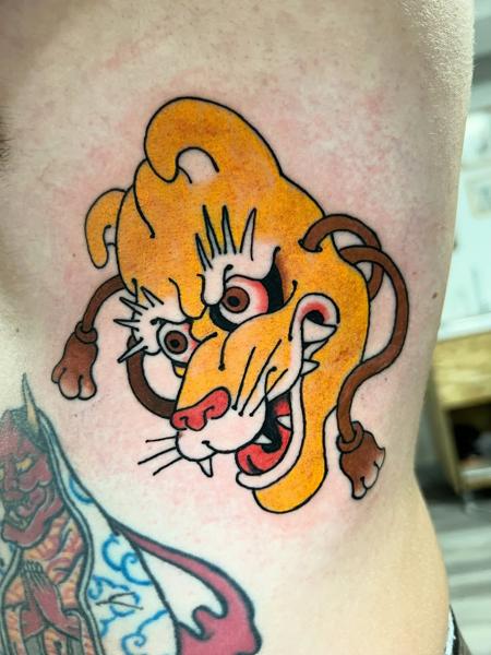 Traditional stylized lion head tattoo by @alex_the_tattooer