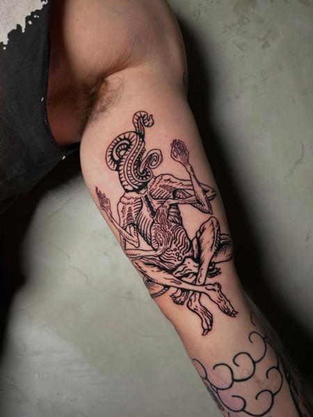 Illustrative blackwork grotesque figure tattoo by @antzas.ttt