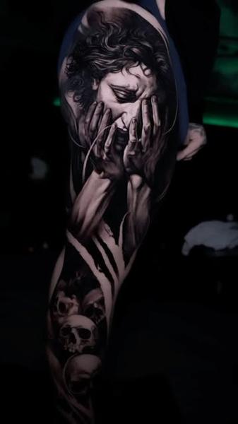 Realism crying figure tattoo by @alx.tattooart