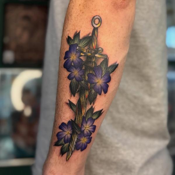 Traditional floral dagger tattoo by @al_xlatattoos