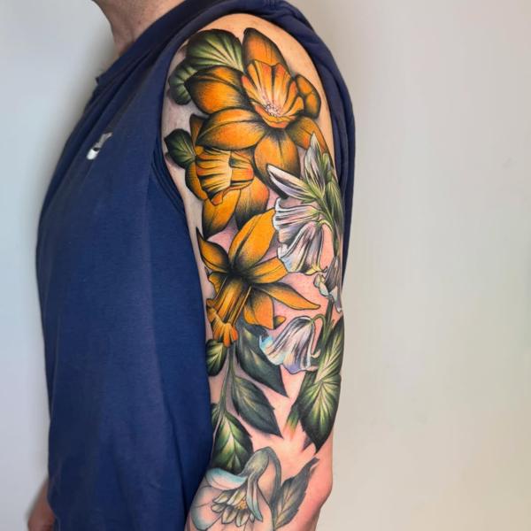 Color realism floral sleeve tattoo by @al_xlatattoos
