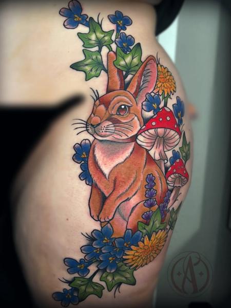 Traditional rabbit and flowers tattoo by @alexmadcity