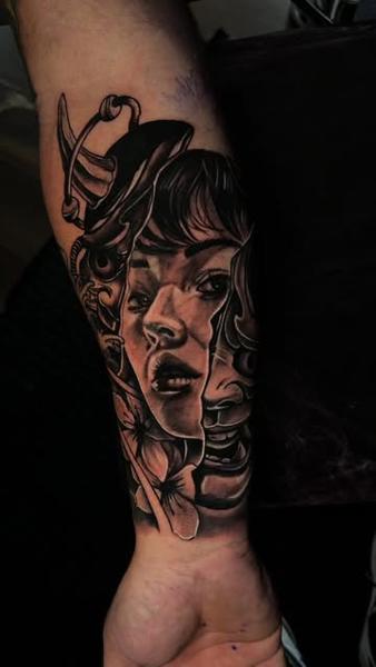 Realism woman and mask tattoo by @ao.tattoos