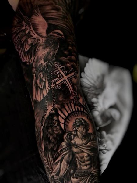 Realism angel and dove tattoo by @ao.tattoos