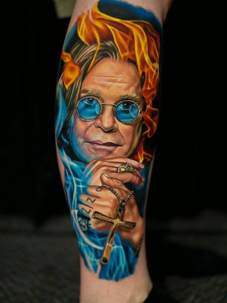 Realism portrait with flames tattoo by @alex_rattray_ink
