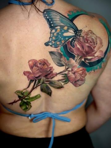 Realism butterfly and roses tattoo by @alexsanto_tattoos