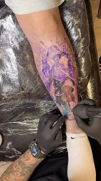 Realism hooded figure tattoo by @alexsanto_tattoos