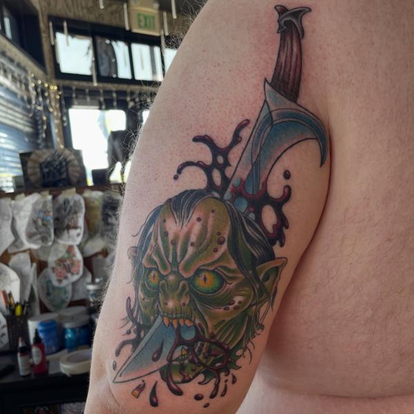 Traditional goblin head tattoo by @alexschwartztattoos