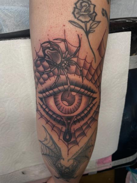 Blackwork spider eye tattoo by @alexschwartztattoos