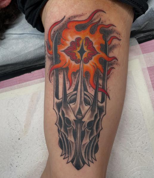 Illustrative flaming helmet tattoo by @alexschwartztattoos