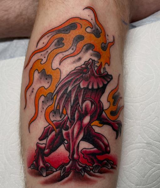 Traditional flaming creature tattoo by @alexschwartztattoos