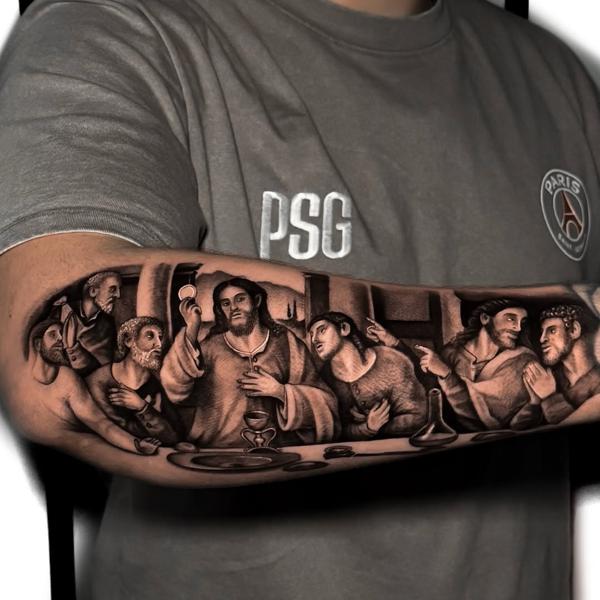 Realism religious supper scene tattoo by @alfie.wyre.s2