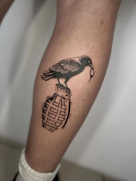 Blackwork crow grenade tattoo by @inked_by_alice