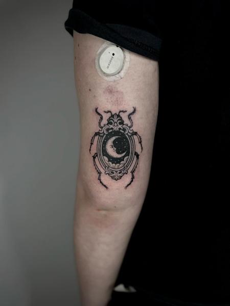 Blackwork celestial beetle tattoo by @inked_by_alice
