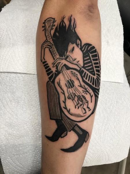 Blackwork guitar player tattoo by @kelpiebat