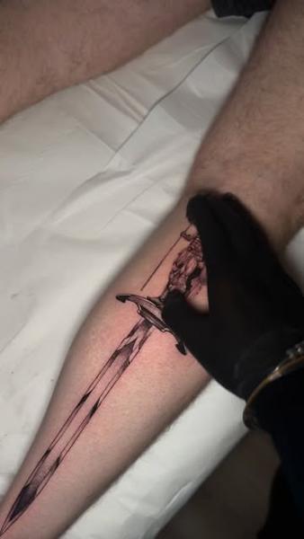 Fine line fantasy sword tattoo by @absolute.dots