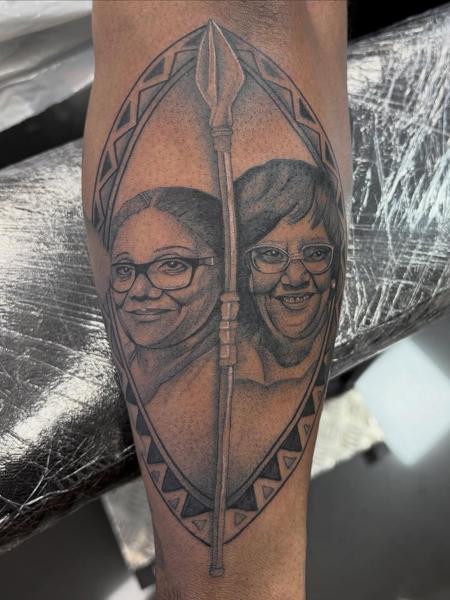 Realism portrait spear tattoo by @amberr.tattoos