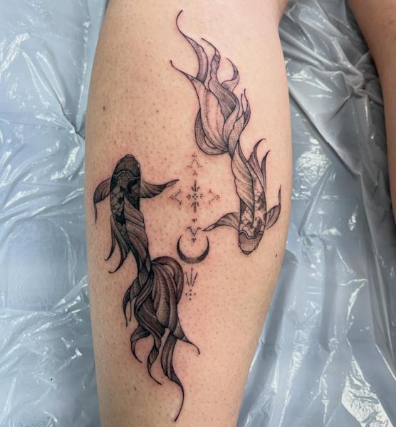 Fine line koi fish tattoo by @amberr.tattoos