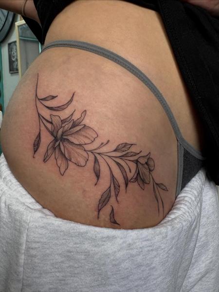 Fine line floral design tattoo by @amberr.tattoos
