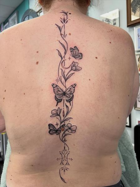 Fine line butterfly vine tattoo by @amberr.tattoos