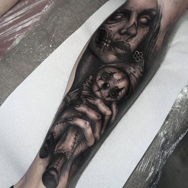 Realism creepy doll tattoo by @amberleena_tattoos