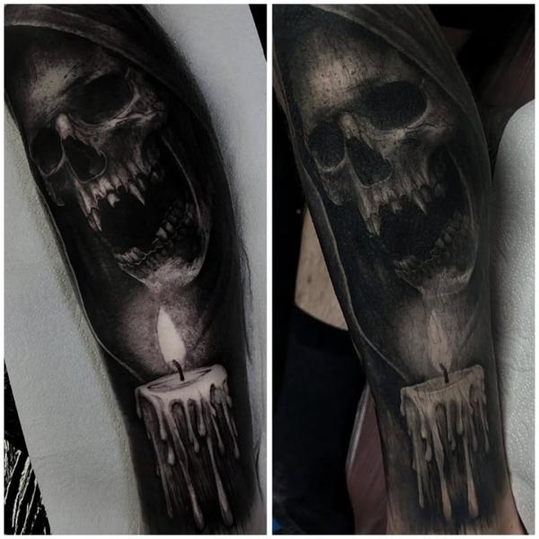 Realism skull with candle tattoo by @amberleena_tattoos
