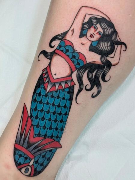Traditional mermaid tattoo by @ambermoontattoo