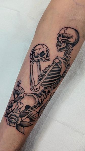 Traditional skeleton with flowers tattoo by @ambermoontattoo