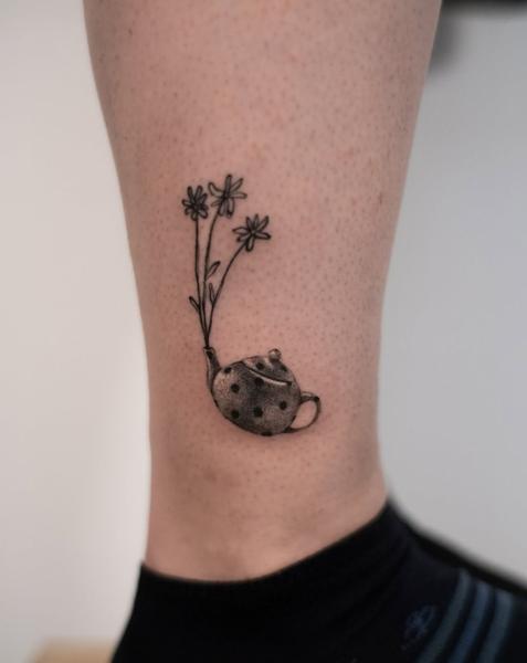 Fine line teapot flowers tattoo by @nastya.tatts