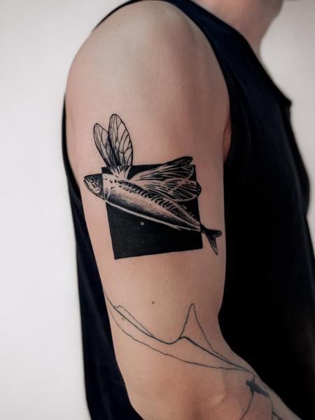 Blackwork flying fish tattoo by @nastya.tatts
