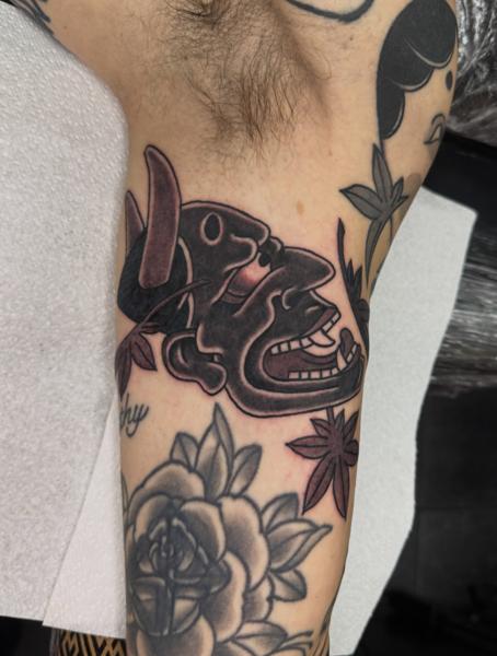 Traditional abstract faces tattoo by @andreafurcitattoo