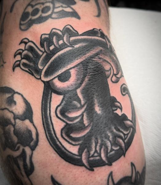 Traditional tentacled creature tattoo by @andrew.bid