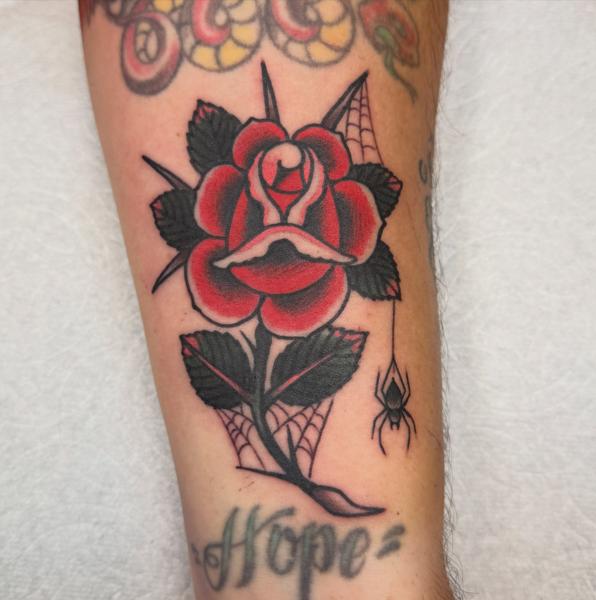 Traditional rose and spider tattoo by @andrew.bid