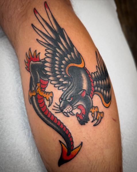 Traditional winged panther tattoo by @andrew.bid