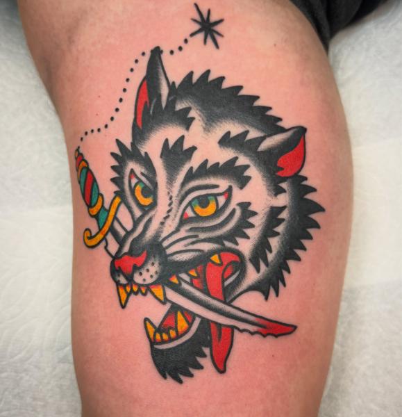 Traditional wolf head tattoo by @andrew.bid