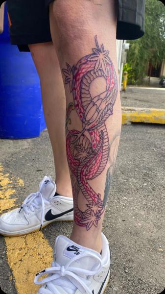 Linework snake and leaves tattoo by @andrewkingtattoo